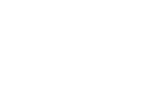 A couple stands close together on a balcony at dusk, sharing an intimate moment beneath the bold "Love Songs" title, with the Your Music Depot logo at the bottom.